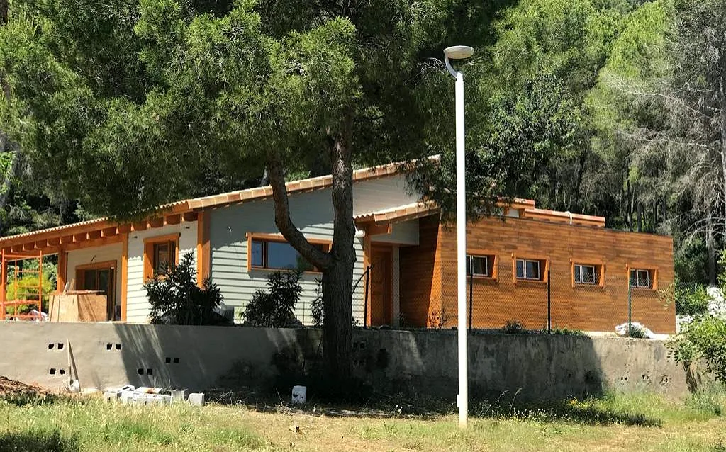 Casa de madera de entramado ligero con fachada de madera en Molló (Girona)